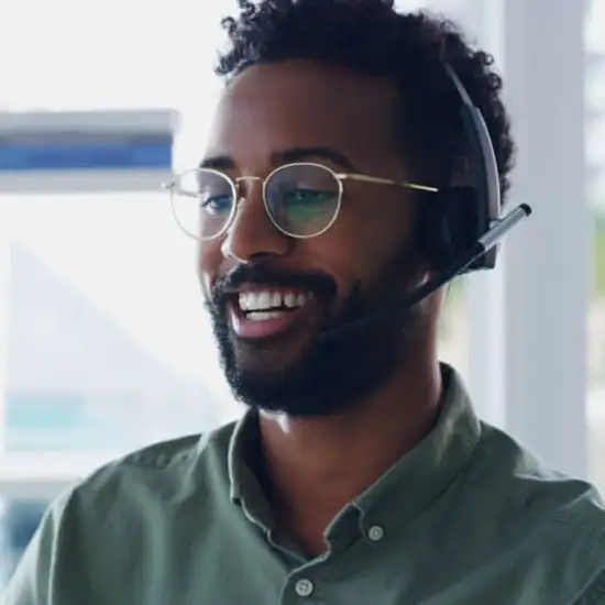 Man on headset working