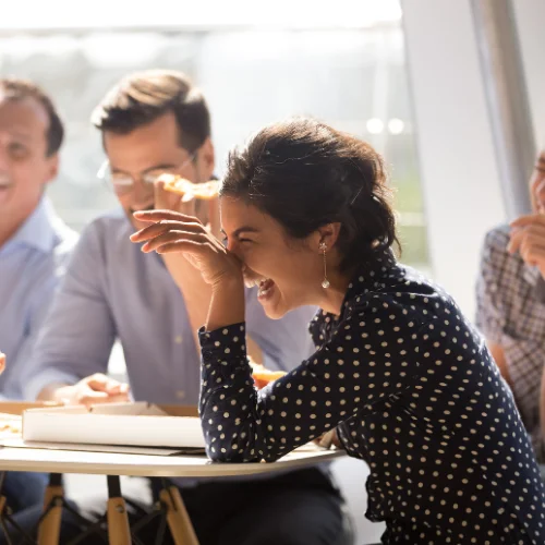 Colleagues laughing while working