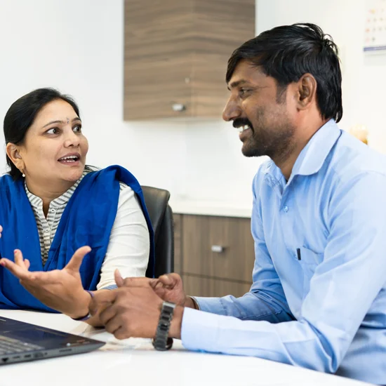 Coworkers discussing topics at a meeting