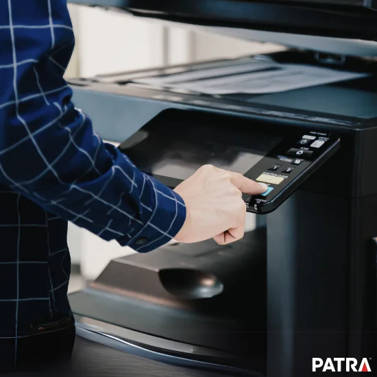 business professional operating an industrial priner