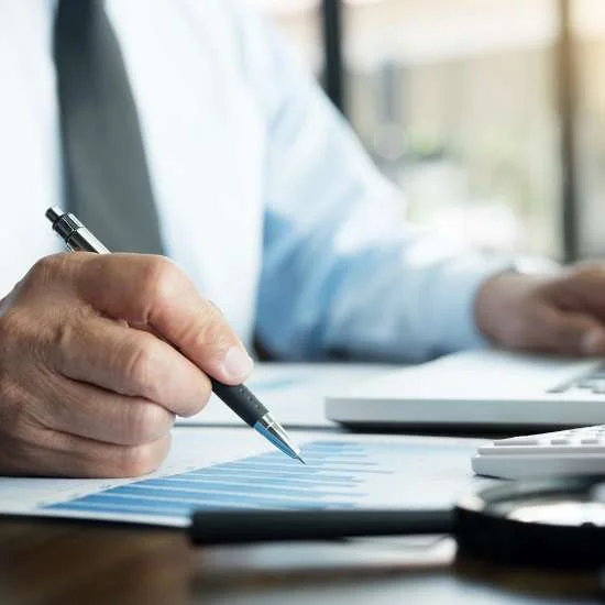 Person sitting down writing