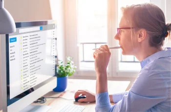 woman reviewing her emails