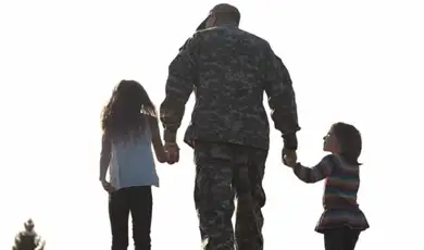 Patra Proud Servicemember Holding Children's Hands