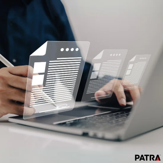 Professional working on laptop reviewing abstract, virtual documents