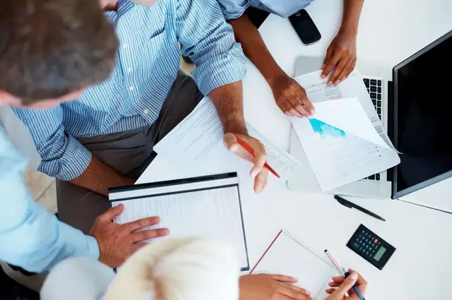 team reviewing costs and turnover metrics team reviewing costs and turnover metrics