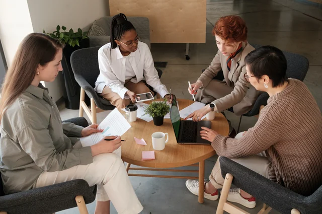 colleagues meeting and reviewing data