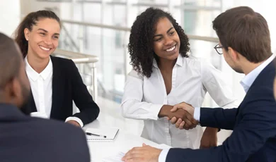 businesswoman shaking hands starting collaboration