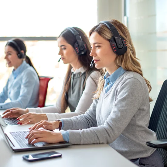 business woman with headset working on laptop