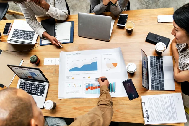 operational efficiency planning strategy reviewing business metrics and data charts