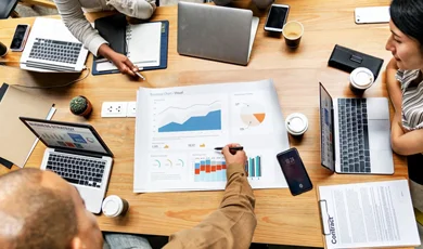 operational efficiency planning strategy reviewing business metrics and data charts