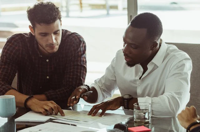 colleagues collaborating on a business plan during a meeting